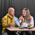 Father and daughter assembling Yak9 stainless steel weathervane kit using tools