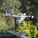 Yak9 weathervane Main kit installed on a balcony railing overlooking an olive grove
