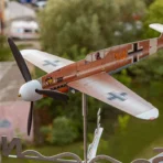 Marseille Bf109F4 stainless steel airplane weathervane installed outdoor in urban environment as kinetic decor