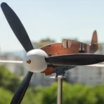 Close up of Bf109F4 Stainless Steel STEM weathervane set installed on balcony as outdoor kinetic decor