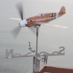 Watching Marseille Bf109 stainless steel kinetic wind sculpture spinning at seaside terrace promotes calm of mind