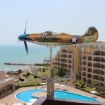 Airacobra P39 weathervane DIY gift kit operating on a seaside terrace - a perfect stress reliever for outdoor spaces