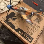 Assembled Bell P39 fighter aircraft kinetic STEM kit displayed on top of its premium gift packaging box